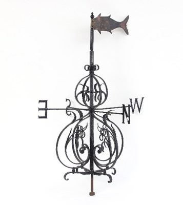 Lot 561 - A wrought iron weather vane with beaten copper...