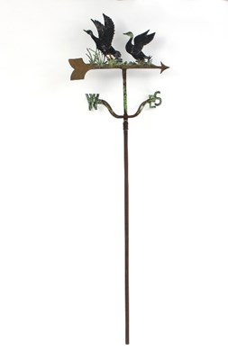 Lot 562 - A cast and wrought iron weather vane decorated...