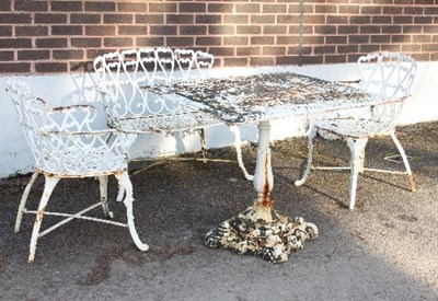 Lot 563 - A painted metal garden bench, two chairs and a...