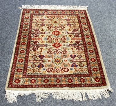 Lot 565 - A modern Eastern rug decorated with four...