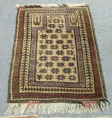 Lot 567 - An Eastern prayer rug, the field of stars...