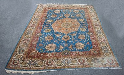 Lot 573 - A Tabriz carpet, the large central medallion...