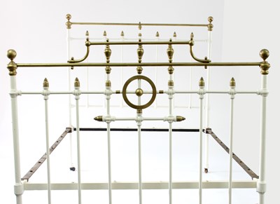 Lot 580 - A brass plated and painted double bed frame,...