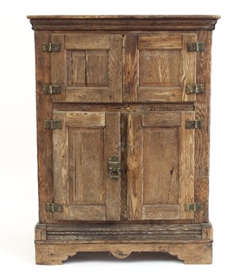 Lot 602 - A Continental pine food cupboard enclosed by...