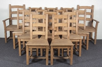 Lot 616 - A set of fourteen beechwood ladder back dining...