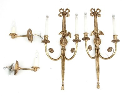 Lot 622 - A pair of two-branch brass wall lights with...