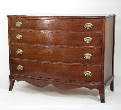 Lot 645 - An early 19th Century bowfront chest of four...