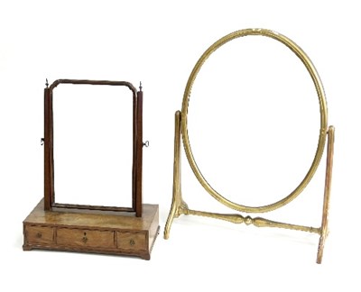 Lot 648 - A mahogany swing frame dressing mirror, the...