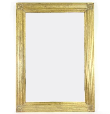 Lot 649 - A gilded wall mirror with fluted frame and...