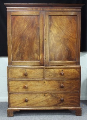 Lot 652 - A late Regency mahogany linen press, the top...