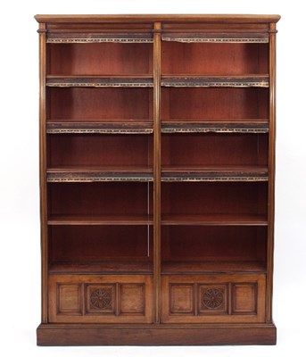 Lot 658 - An Edwardian walnut bookcase fitted eight...