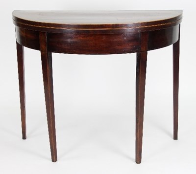 Lot 662 - A George III mahogany tea table, the folding...