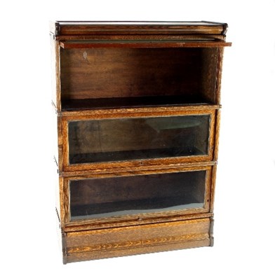 Lot 665 - A Globe Wernicke type oak bookcase of three...