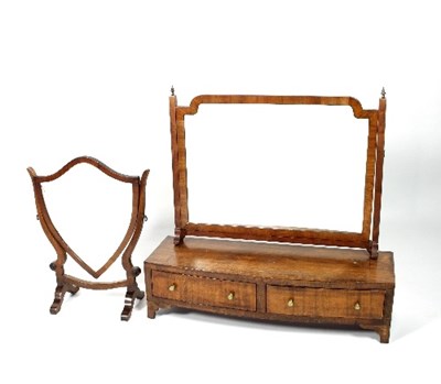 Lot 677 - A mahogany swing-frame toilet mirror, the...