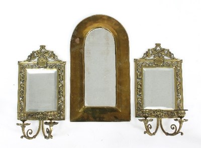 Lot 683 - A pair of brass wall mirrors with two...