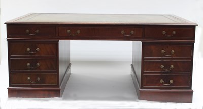 Lot 689 - A mahogany partners' desk, the top with inset...