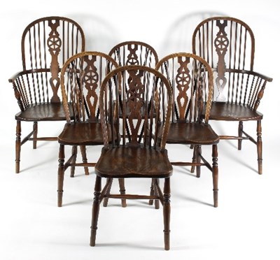 Lot 691 - A set of six Windsor type wheel back chairs...