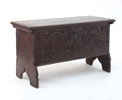 Lot 704 - An 18th Century oak coffer, with later carved...