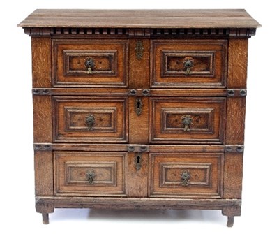 Lot 713 - A Charles II oak chest of three long geometric...