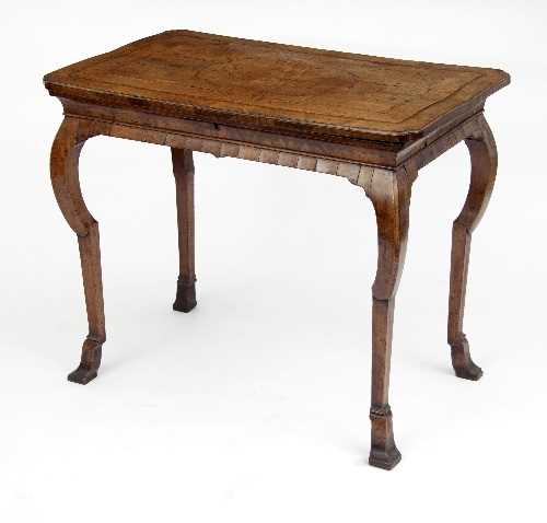 Lot 721 - A Queen Anne walnut veneered table, the hinged...