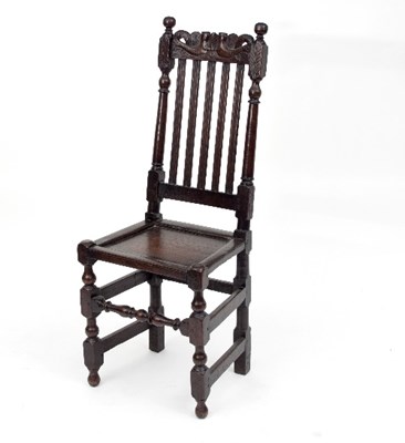 Lot 723 - A Charles II oak side chair with conjoined...