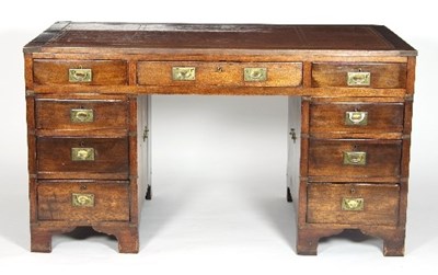 Lot 732 - A mahogany campaign style partner's desk,...