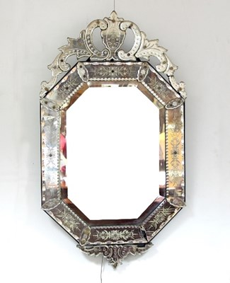 Lot 751 - A Venetian style wall mirror with scrolling...