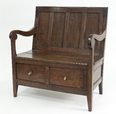 Lot 760 - A monk's oak bench with panelled back, the...