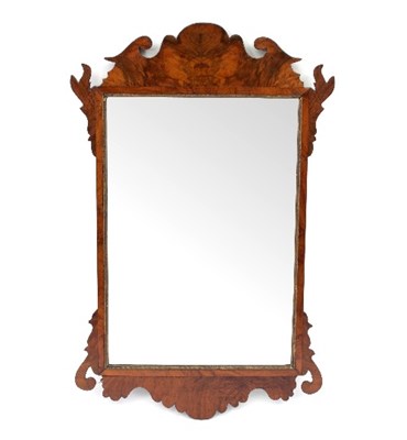 Lot 767 - A George III walnut fret carved mirror, 73cm high