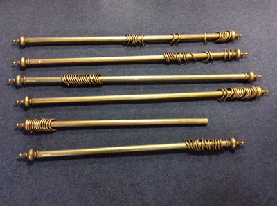 Lot 787 - Six gilt painted curtain poles, each with...