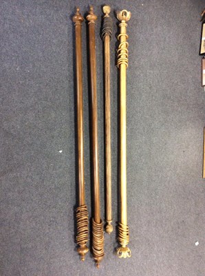 Lot 788 - A pair of gilt painted curtain poles with...