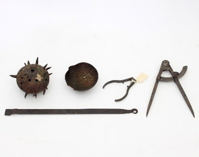 Lot 844 - A pierced and spiked iron ball possibly from a...