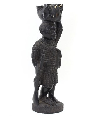 Lot 850 - A carved hardwood tribal figure, Benin, mid...