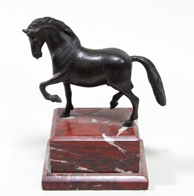 Lot 872 - A bronze figure of a pacing stallion on a...