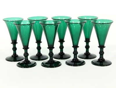 Lot 8 - Eight green glass wine glasses with knopped...