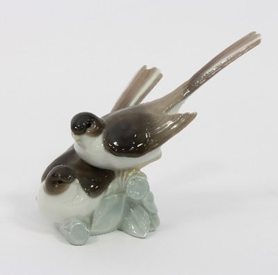 Lot 34 - A Lladro figure, a pair of swifts, 18.5cm high