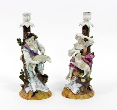 Lot 37 - A pair of Continental figural candlesticks,...