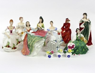 Lot 41 - Eight Royal Doulton figures to include Queen...