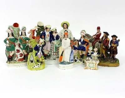 Lot 83 - A quantity of Staffordshire figures including...