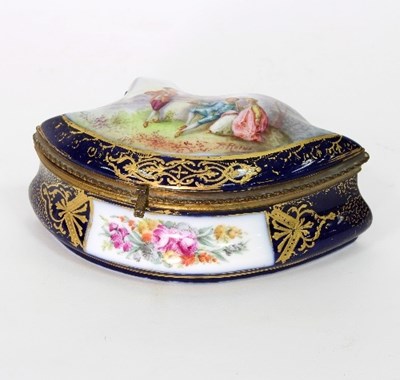 Lot 89A - A French porcelain box of asymmetrical shape,...