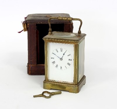 Lot 92 - An eight-day carriage clock in a gilt brass...