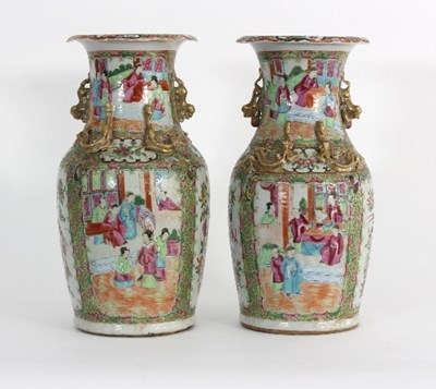 Lot 111 - A pair of Cantonese vases painted alternating...