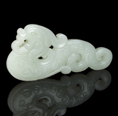 Lot 112 - A Chinese white jade phoenix pendant, carved...