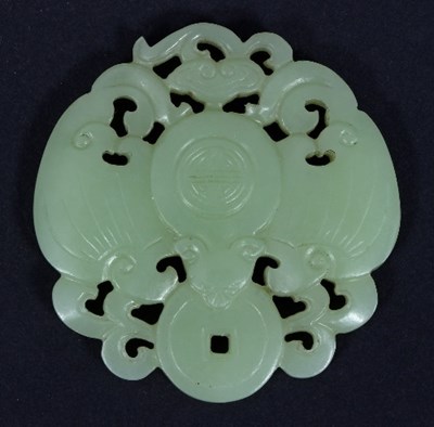 Lot 114 - A Chinese yellow jade bat and coin pendant, of...