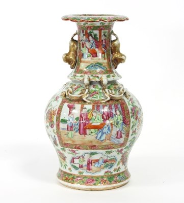 Lot 124 - A Cantonese vase with flanged top and dog of...