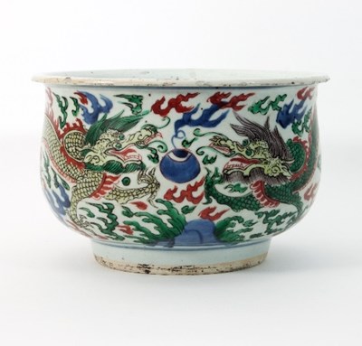 Lot 147 - A Chinese wucai bowl, decorated dragons and...