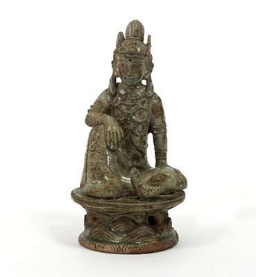 Lot 154 - A South East Asian green glazed pottery figure...