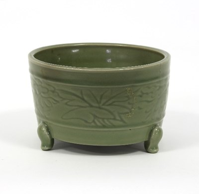 Lot 161 - A Chinese celadon bowl incised with flowers...