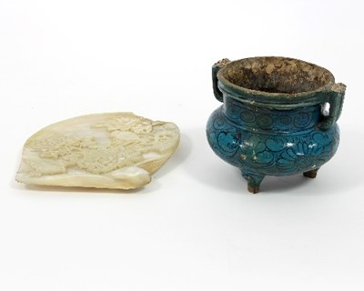 Lot 166 - A Persian pottery bowl, decorated in blue...