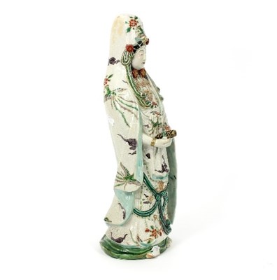 Lot 181 - A Chinese ceramic figure of Guanyin, modelled...